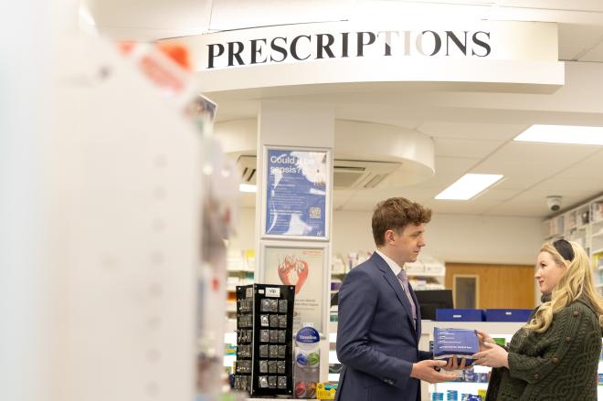 Irish Patient receiving prescription in pharmacy